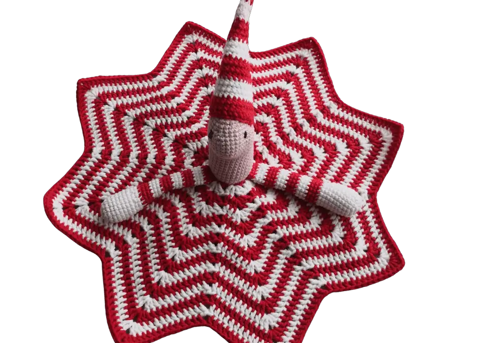 Star-patterned blanket part of a crochet clown lovey