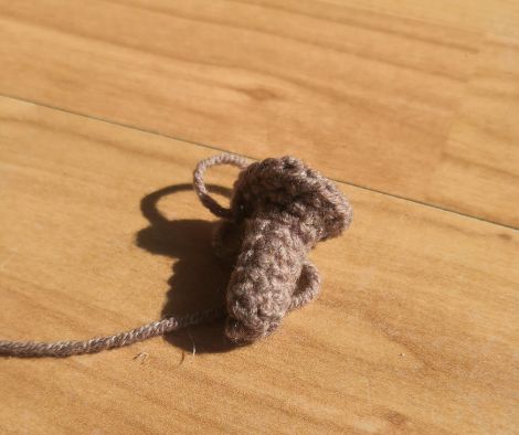 Brown crocheted stem of the little pumpkin