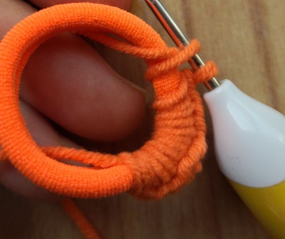 Brown crocheted stem of the little pumpkin