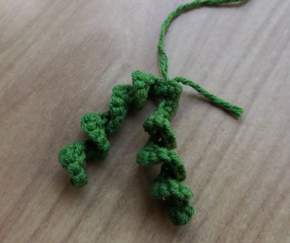 Brown crocheted stem of the little pumpkin