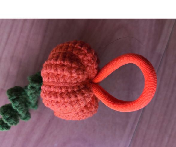 Brown crocheted stem of the little pumpkin